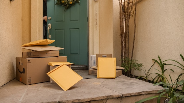 Packages and parcels at the porch of a front door. Photo by Kindel Media from Pexels