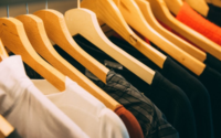 Close up of clothing rack with clothes on hangers. Photo by Kai Pilger from Pexels